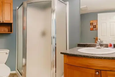 a bathroom with a sink and a shower at Trailblazers Retreat 3 Bed with Family Games Room in Big White