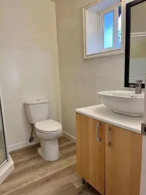 a bathroom with a toilet and a sink at Whole Suite to Yourself at Coquitlam Centre! in Port Coquitlam