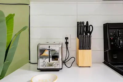 a toaster sitting on a counter next to a stove at Hidden Gem: Historical Gastown in Vancouver