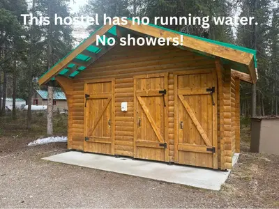 a wooden building with no running water no showers at HI Mosquito Creek - Wilderness Hostel in Lake Louise