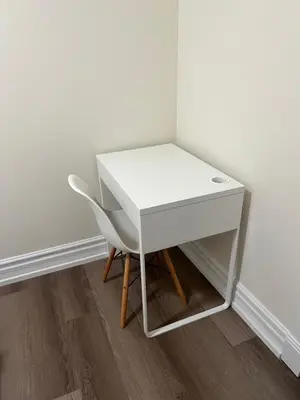a white desk and a chair next to a wall at Private suite 1 bed 1 bath 15 mins YVR and downtown \u8212\u9002\u5b89\u9759 in Vancouver