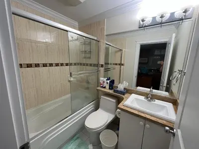 a bathroom with a toilet and a sink and a shower at Private suite 1 bed 1 bath 15 mins YVR and downtown \u8212\u9002\u5b89\u9759 in Vancouver