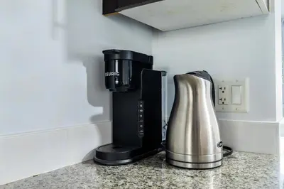 a coffee maker sitting on a counter in a kitchen at Downtown 1 Bedroom Water View Condo in Vancouver