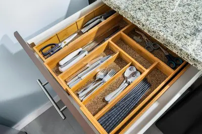 a wooden drawer with cutlery in it at Downtown 1 Bedroom Water View Condo in Vancouver