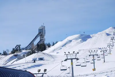 a snow covered ski slope with a ski lift at Private Entire Townhouse Retreat Close to Lake in Calgary