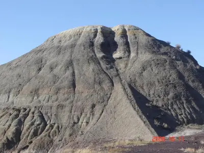 a mountain with a face on the side of it at Hoo-Doo Motel in Drumheller