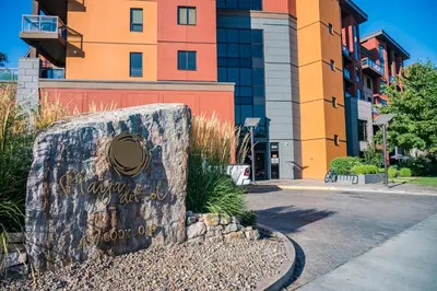 a sign in front of a building at Resort Style Living with Private Lawn and Patio in Kelowna