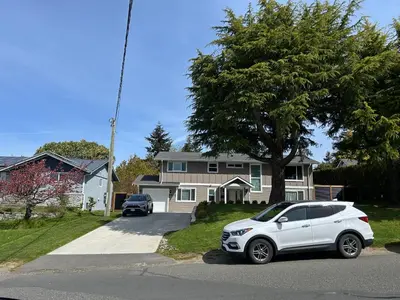 a white car parked in front of a house at Blue Sea And Clear Sky B&B LICENCE NUMBER 18952 in Victoria