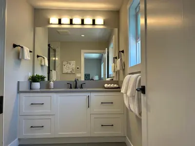 a bathroom with a sink and a mirror at Blue Sea And Clear Sky B&B LICENCE NUMBER 18952 in Victoria