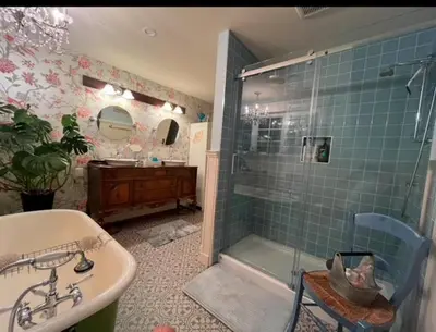a bathroom with a shower and a sink and a tub at The Hazelhouse in Chilliwack