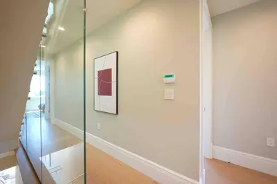 a hallway with a glass door in a house at Four bedrooms New Lovely Duplex -1626 in Vancouver