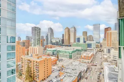 an aerial view of a city with tall buildings at Luxury 2BR Condo - King Bed - Stunning City Views in Calgary
