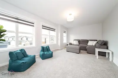 a living room with a couch and two chairs at Orchards Retreat, AC, Family Friendly, Sleeps 10, NearAirprt in Nisku