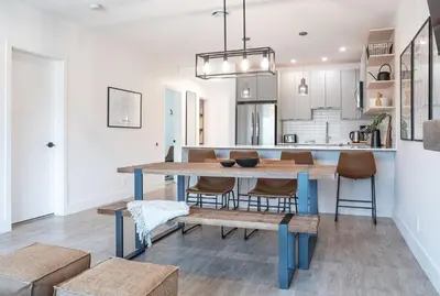 a kitchen and dining room with a table and chairs at Glades and Greens by Revelstoke Vacations in Revelstoke
