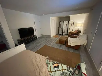 a living room with a couch and a television at Stunning 5-bed Retreat in Sunshine Valley in Sunshine Valley