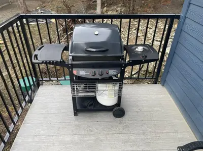 a grill sitting on a railing on a porch at Stunning 5-bed Retreat in Sunshine Valley in Sunshine Valley