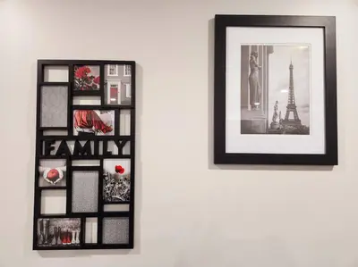 a framed picture of the eiffel tower on a wall at Comfort First - sleeps 6 in Whitehorse