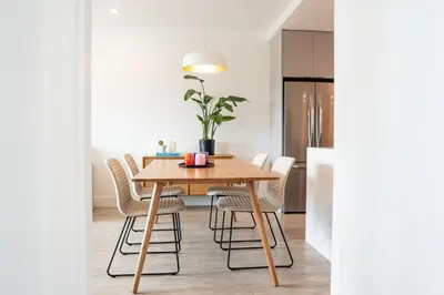 a dining room with a wooden table and chairs at Galena by Revelstoke Vacations in Revelstoke