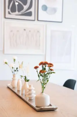 a tray with vases and flowers on a table at Western Star by Revelstoke Vacations in Revelstoke
