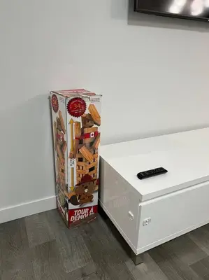 a box of candy next to a white table at Modern Luxury Private Suite in Airdrie