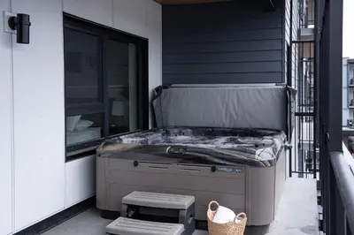 a bed on the side of a house at RevelStoked Getaway by Revelstoke Vacations in Revelstoke