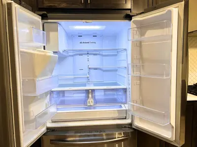 an empty refrigerator with its door open in a kitchen at Flowealth Property Luxury Villa Near Lake Netflix TV Wifi in Calgary