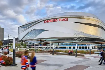 a view of a football stadium with people walking around it at Downtown Near Rogers Place with Covered Parking, Sleeps 6, Pool Table, Sauna, Gym, Two Bedrooms & More in Edmonton
