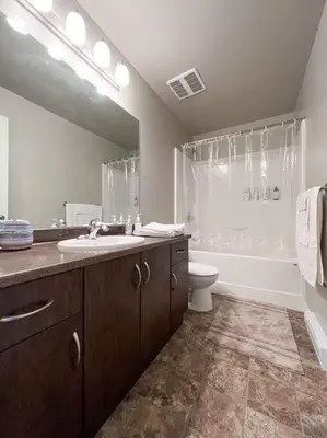 a bathroom with a sink and a shower and a toilet at Entire 3-bedroom house Near Town in Victoria