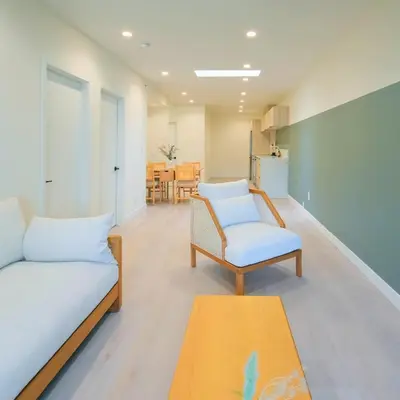 a living room with a couch and a chair at Newly Renovated 2 Bedroom Condo in Japantown! Near Railtown & Gastown! in Vancouver