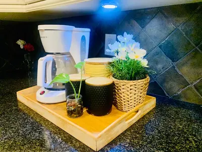 a counter with a coffee maker and plants on a cutting board at Scorpio House Langley -ROOM 2 in Langley
