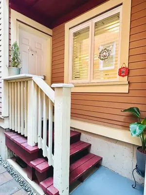 a house with stairs leading to the front door at Private Guest Suite 10mins to Downtown - King Bed - Bathtub - Free Parking in Vancouver