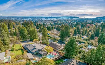 an aerial view of a home in the woods at Private Bedroom, Bathroom, Shared Outdoor Pool, Hot Tub in North Vancouver