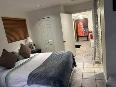 a bedroom with a bed and a bathroom at Private Bedroom, Bathroom, Shared Outdoor Pool, Hot Tub in North Vancouver