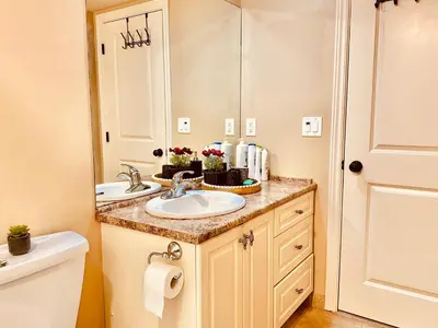 a bathroom with two sinks and a mirror at Scorpio House Langley -ROOM A in Langley