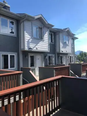 a row of houses on a balcony with a fence at Mountain view walk to all in Canmore Canada in Canmore