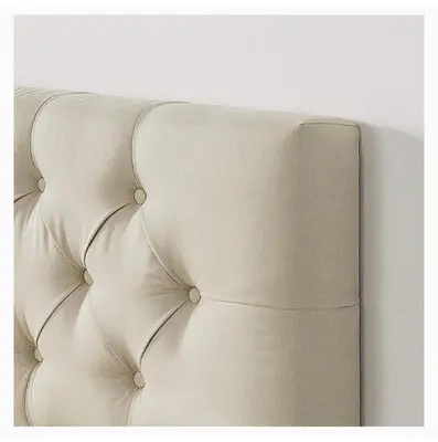 a white couch sitting against a white wall at Near Skytrain and QUIET Private Bedroom Ensuite BathRM, Free Wifi & Coffee, Cozy in Burnaby