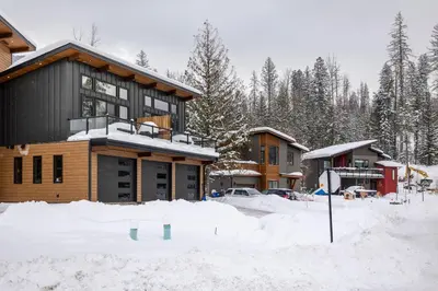 a house in the snow with a lot of snow at 22 Sunniva by StayIn in Fernie