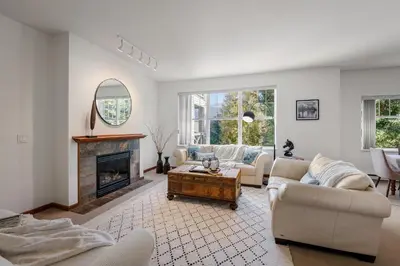 a living room with a couch and a fireplace at Desirable Blueberry Hill in Whistler