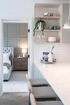 a room with a bed and a kitchen with a table at Stoked 4Ever - Revelstoke Condo (+Hot Tub) in Revelstoke