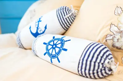 a woman laying on a couch with tattoos on her legs at Madeira Park Oceanview Suites in Madeira Park
