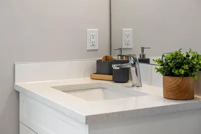 a kitchen counter with a sink and a faucet at Serene Peaks, Private Hot Tub, Peaceful in Radium Hot Springs