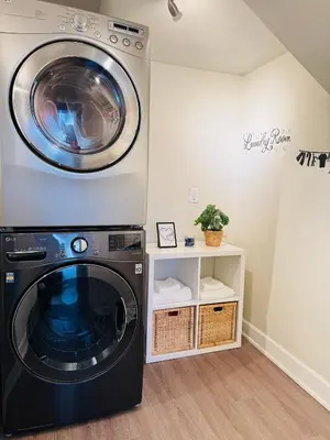 a washer and dryer in a laundry room at Creek Side 2-Bedroom Guest Suite in Burnaby