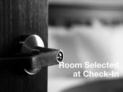 a close up of a door knob on a wooden door at A Good Nite's Rest Bed and Breakfast in Banff