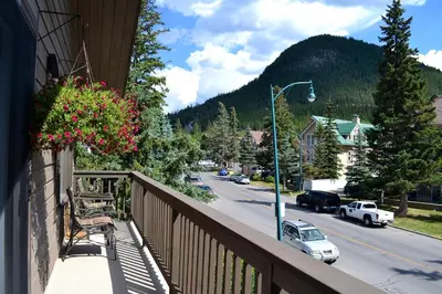 a balcony with a view of a street in a town at A Good Nite's Rest Bed and Breakfast in Banff