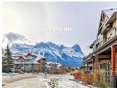 a view of a town with a mountain in the background at Canmore Mountain Views -3Beds-Ski Stay Deals in Canmore