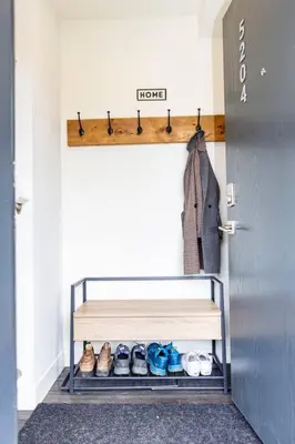 a closet with a shelf with shoes and a door at Reved Up & Out - Remarkable Two Bedroom Condo in Revelstoke