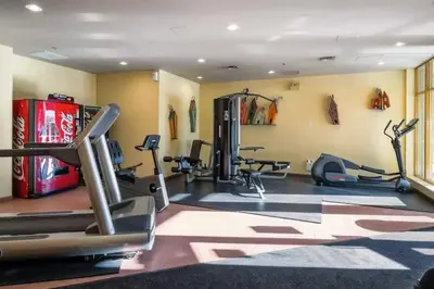 a gym with treadmills and machines in a room at Renovated 2Bed-2Bath in Village with Pool, Hot Tub, and Sauna in Whistler
