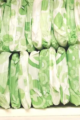a pile of green and white curtains on a shelf at 12 Spacious Home W Ac, Crib, Garage, By Airport in Calgary