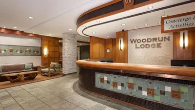a lobby of a woodbury lodge with a pool at Woodrun Lodge 214 | Ski-in-Ski-Out Condo, Heated Pool, Hot Tub, Gym in Whistler