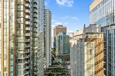 a group of tall buildings in a city at Downtown Luxury 1BR Coal Harbour in Vancouver